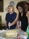 Marta blurred, Juliana cutting dessert