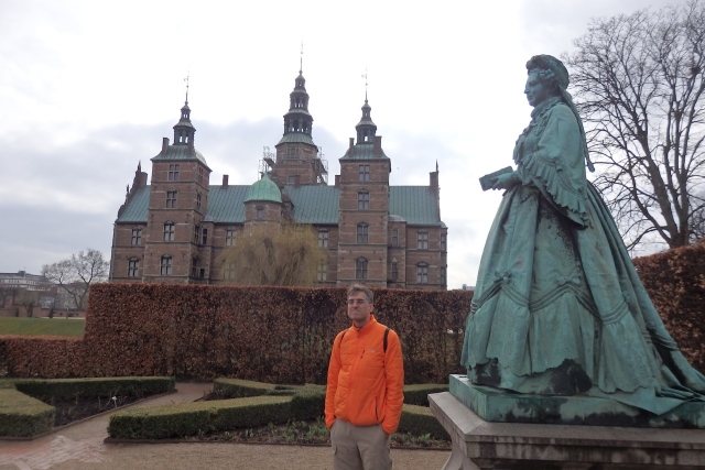 Rosenborg Castle with the statue of the Dowager Queen Caroline Amalie in the rose garden